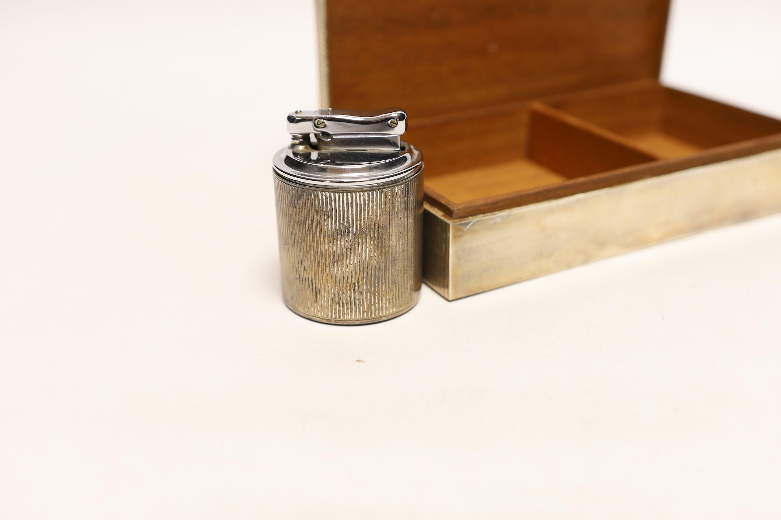 A sterling 925 mounted rectangular cigarette box, with reeded cover, 17.4cm and a similar unmarked cigarette lighter.